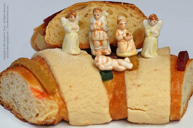 Plastic figurines or dolls hidden inside a Rosca de Reyes pastry. Photo © Joseph A. Tyson